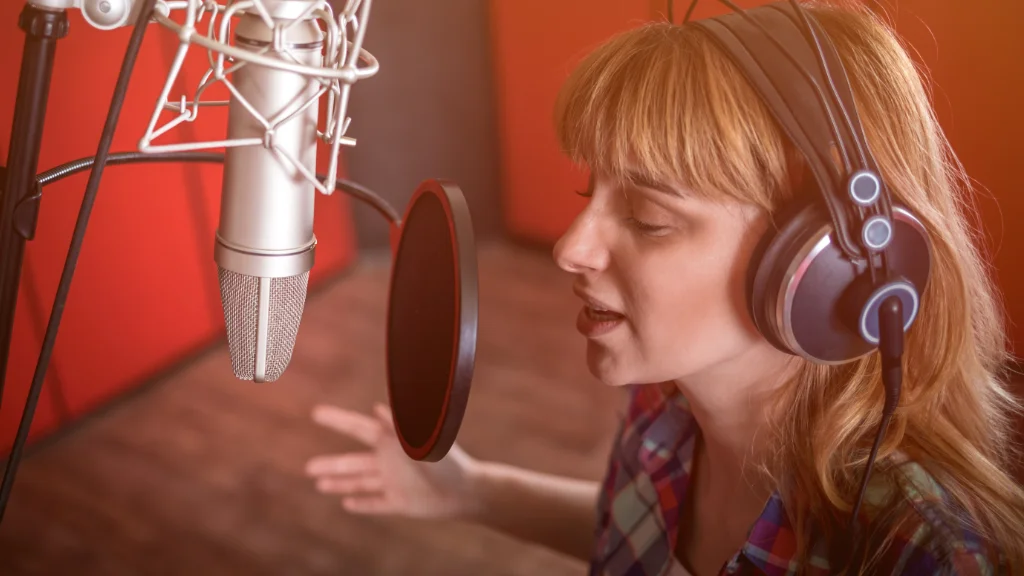 Female voiceover recording in professional studio